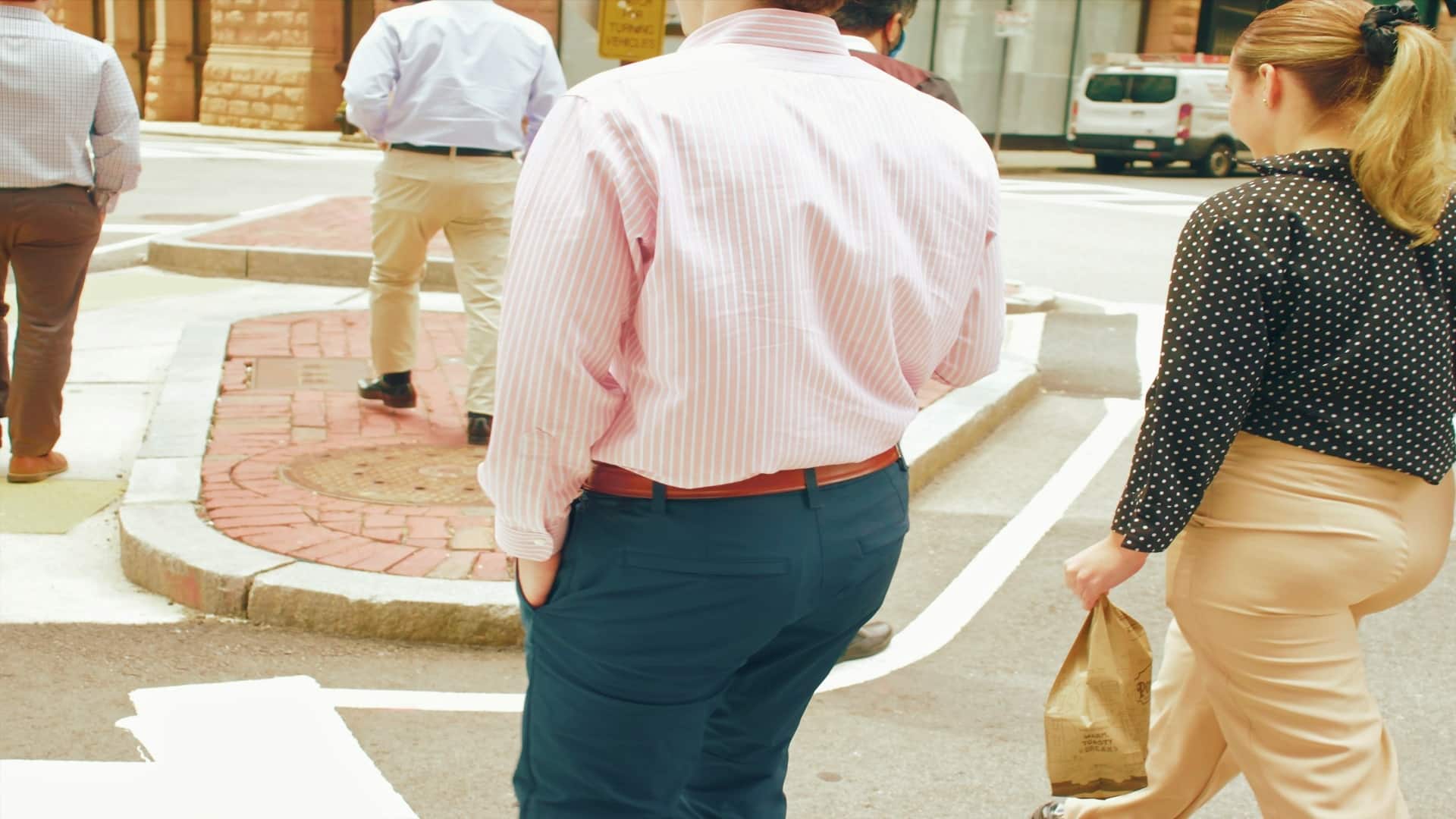 man walking beside partner attentively