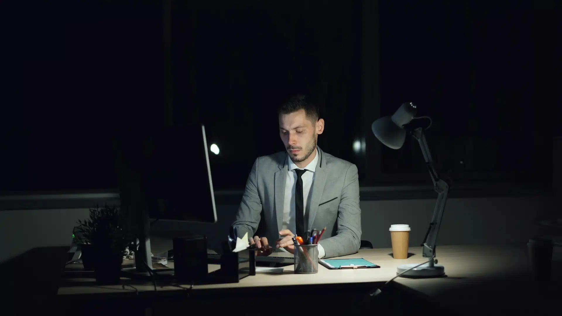 man working late at desk