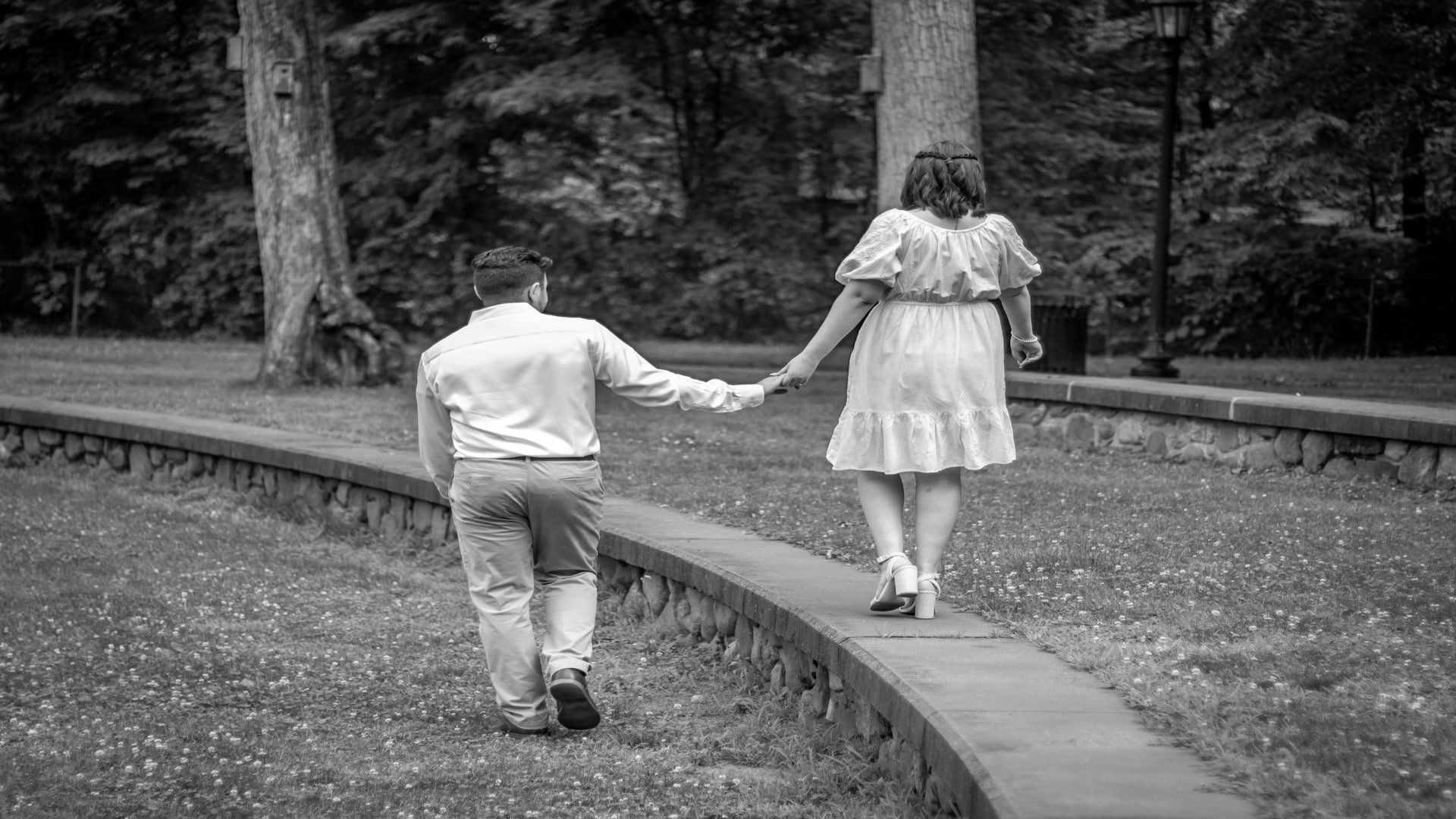 couple holding hands walking