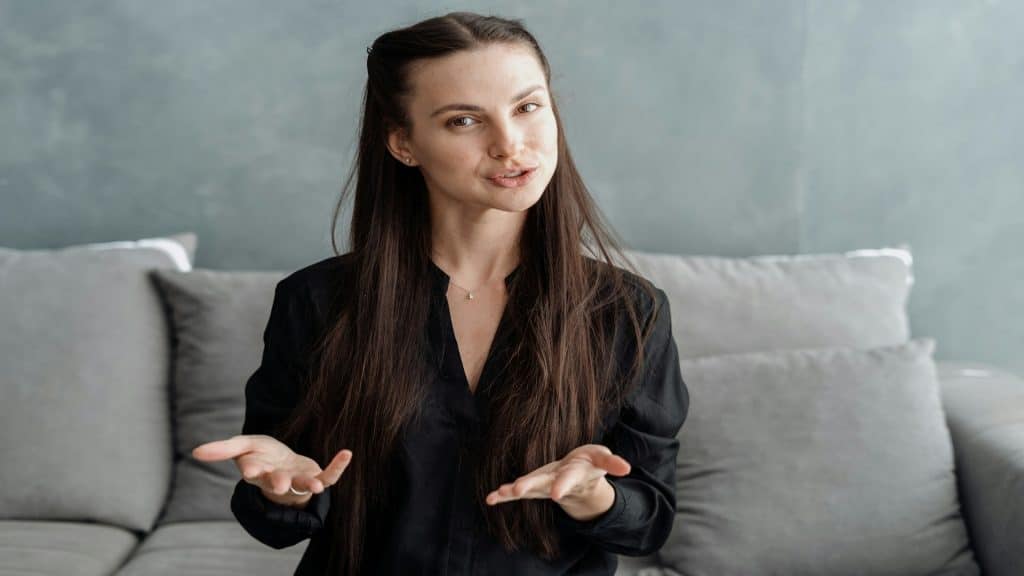 woman expressing emotion during conversation