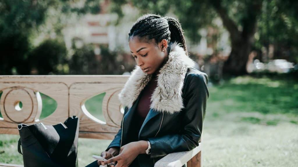 A woman sitting on a park bench