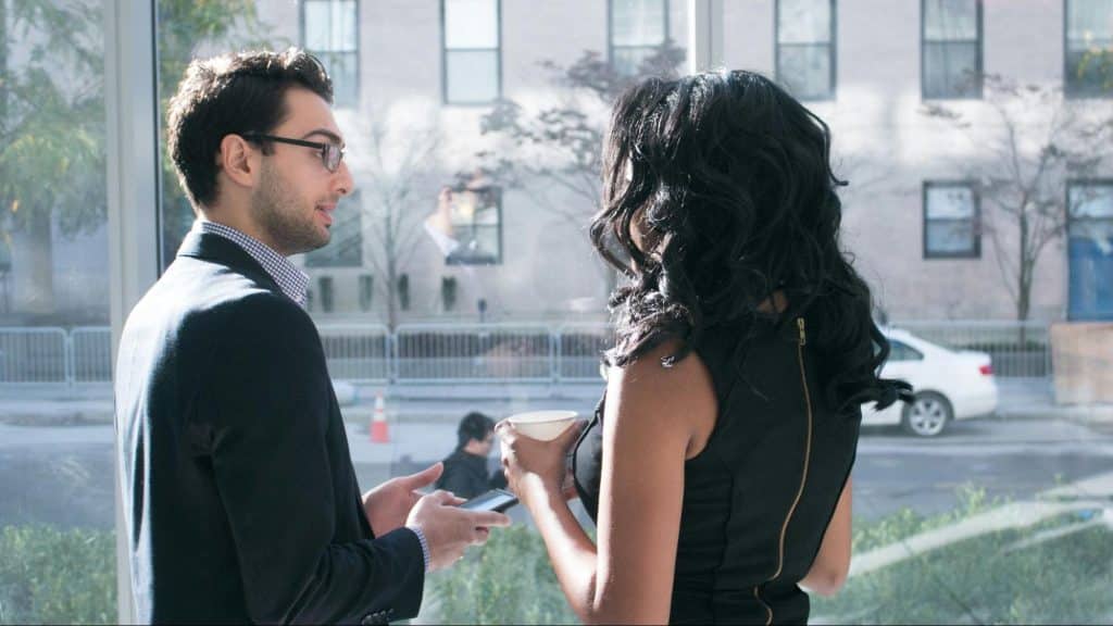 A man talking to woman