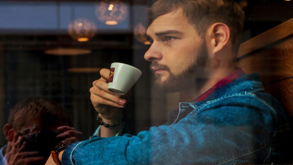 man looking distant while thinking