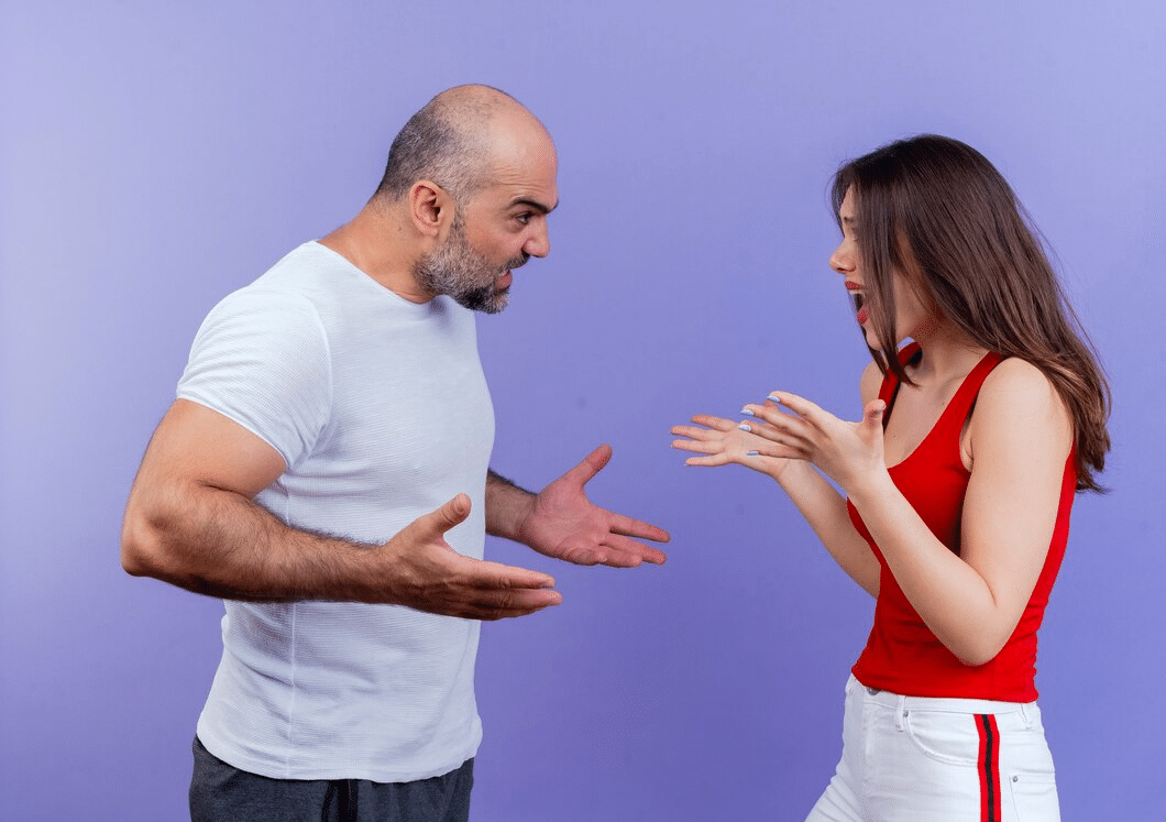 Couple shouting at each other in conflict