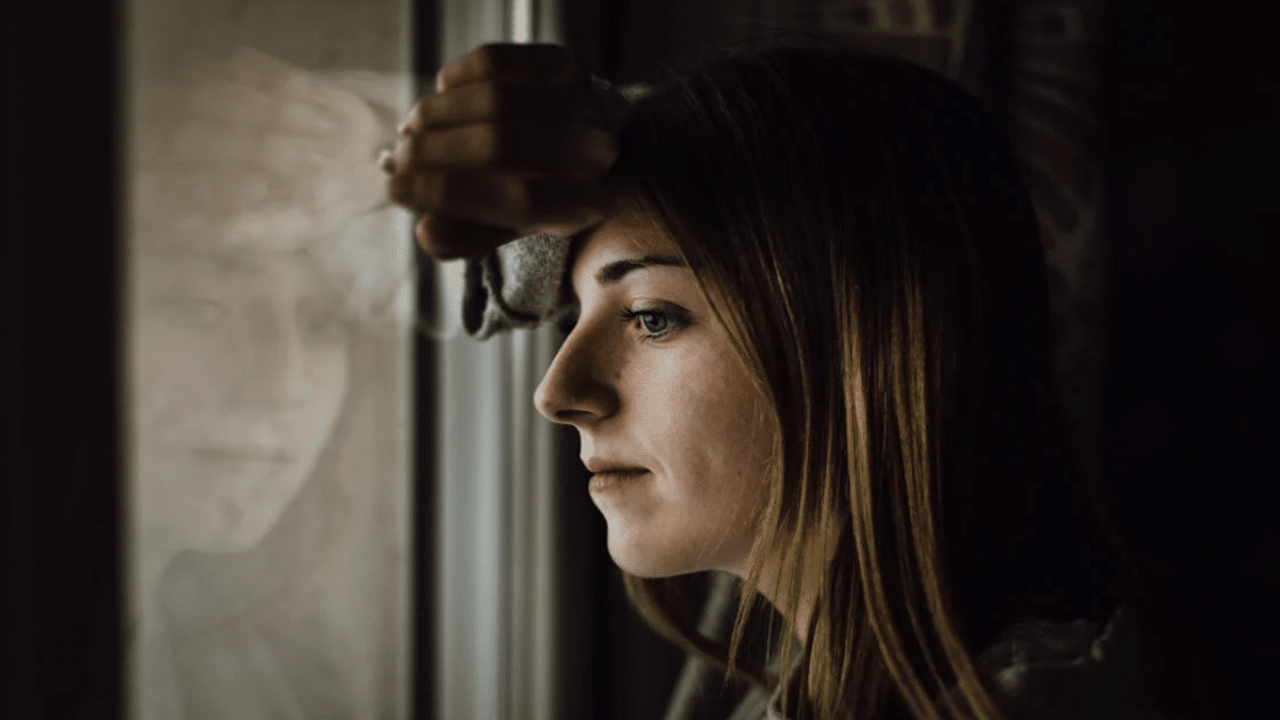 A woman looking out the window