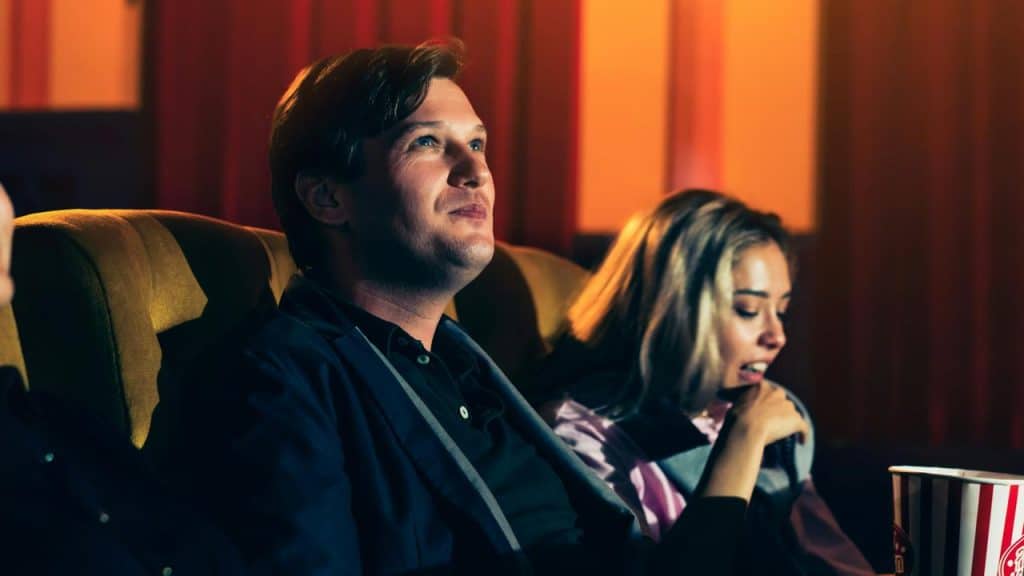 A couple sitting in a movie theater