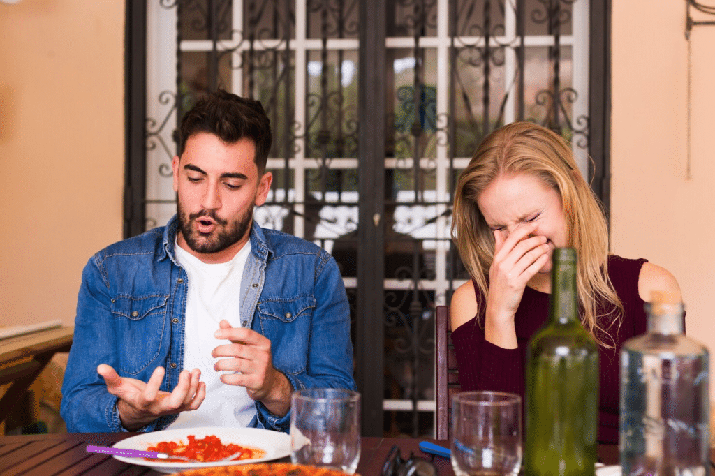 A man reacting negatively during date
