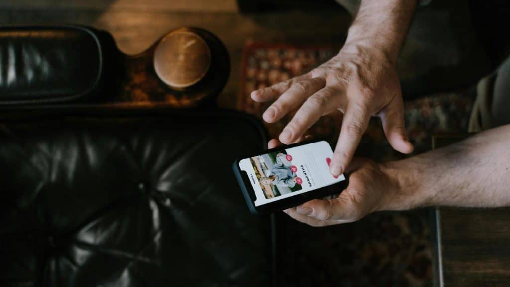 A person using a dating app on their smartphone.
