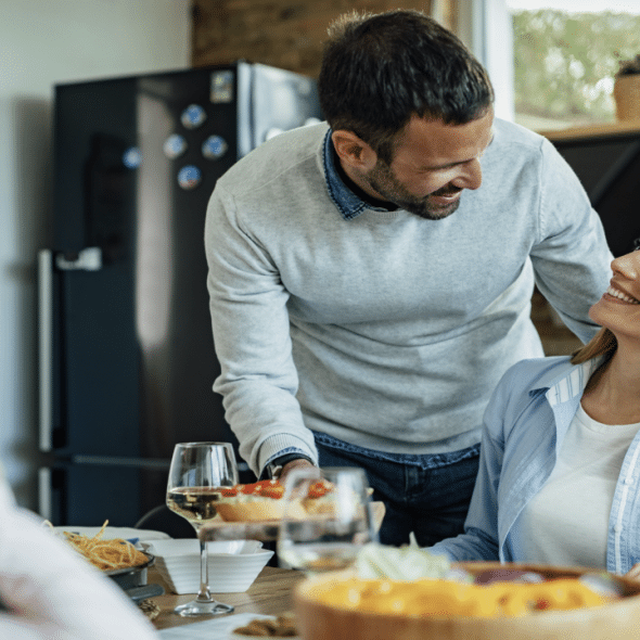 A couple talking to his wife during a family lunch