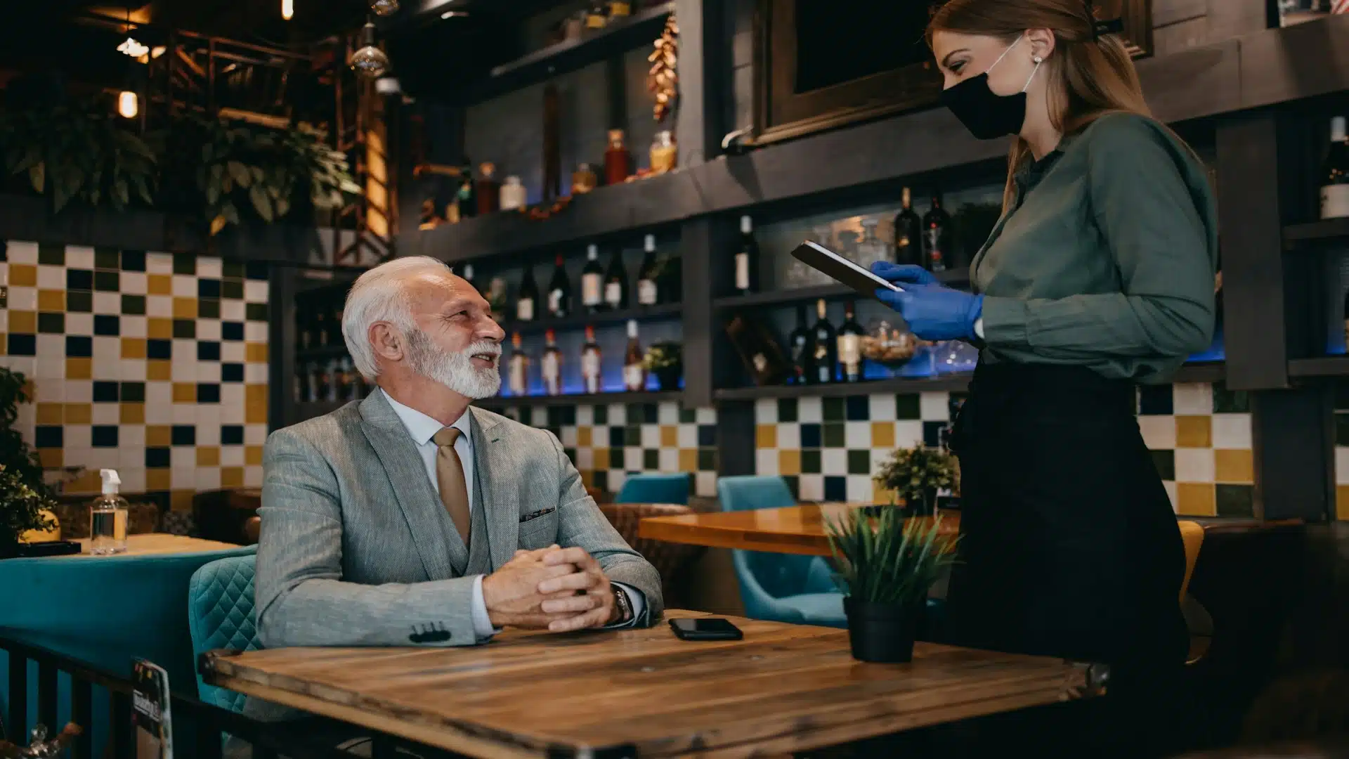 man speaking politely with waiter