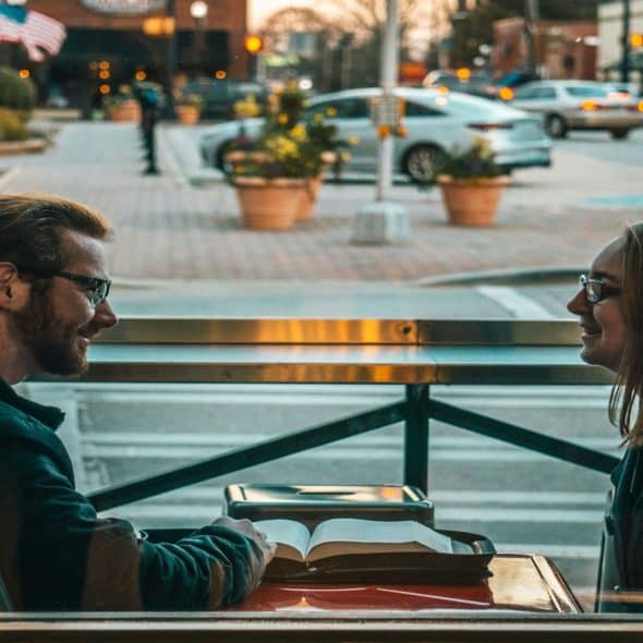 man and woman talking during a date