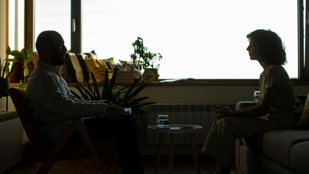 A man and woman talking