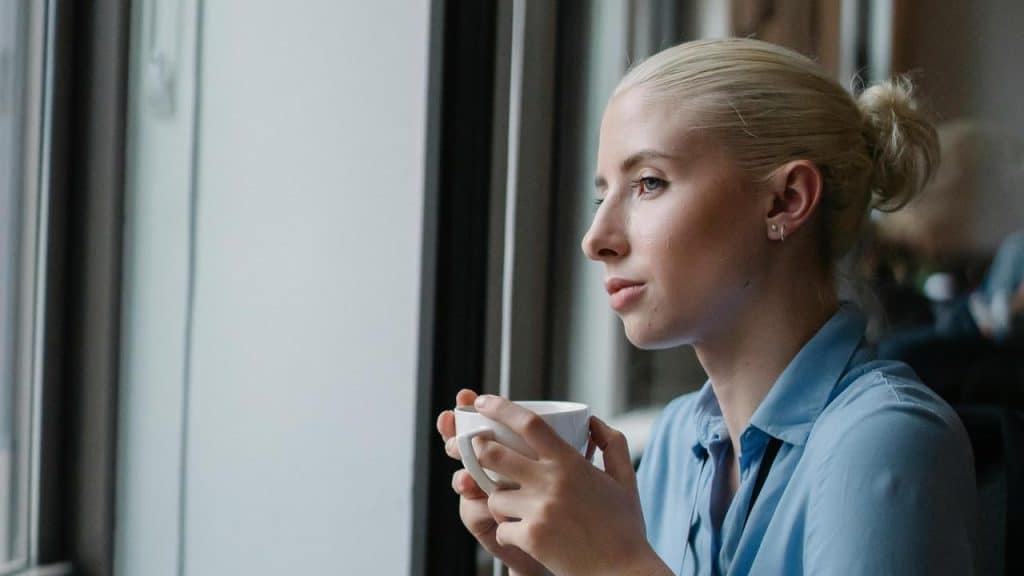 A woman holding a cup