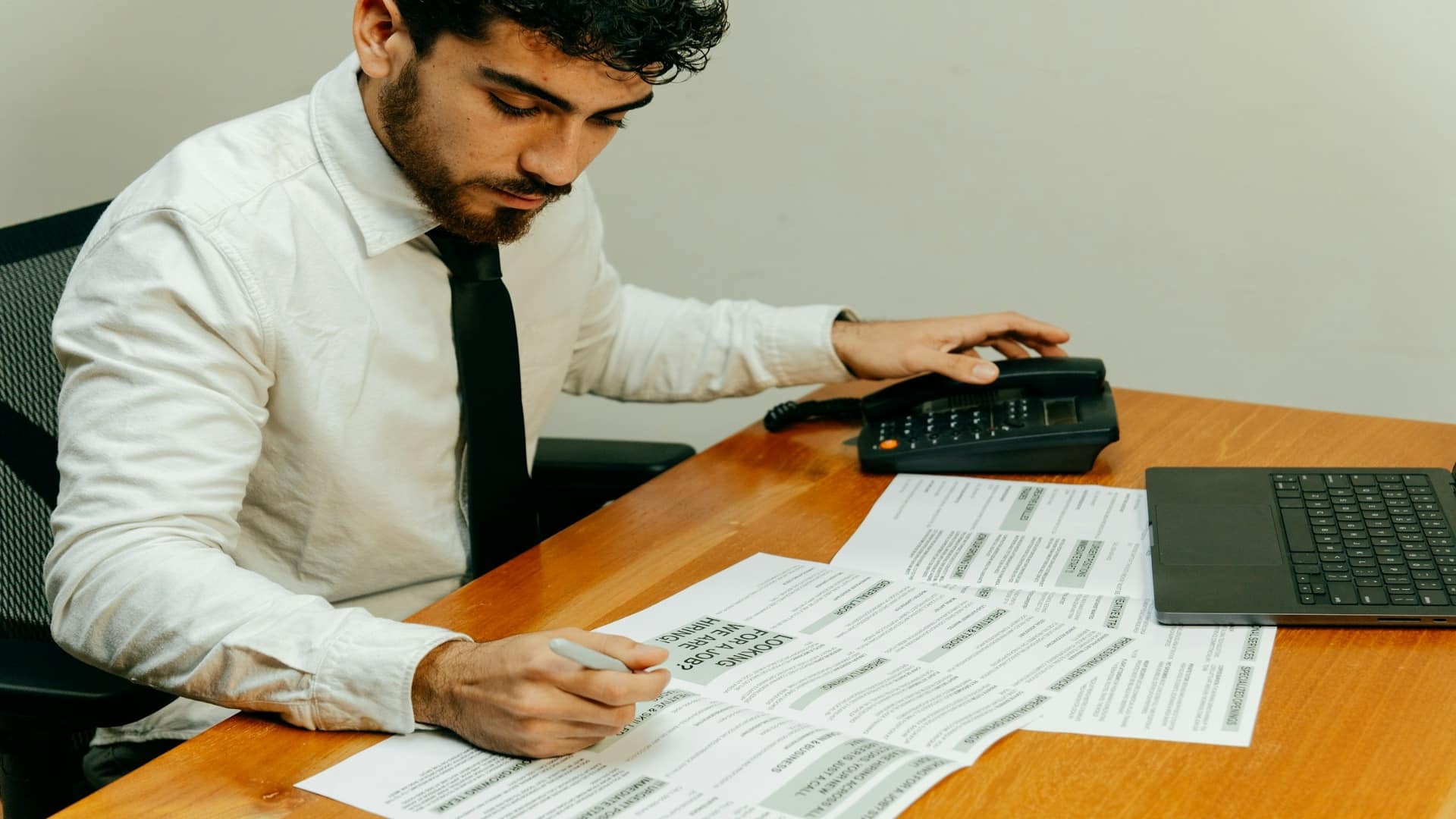 man reviewing finances at desk
