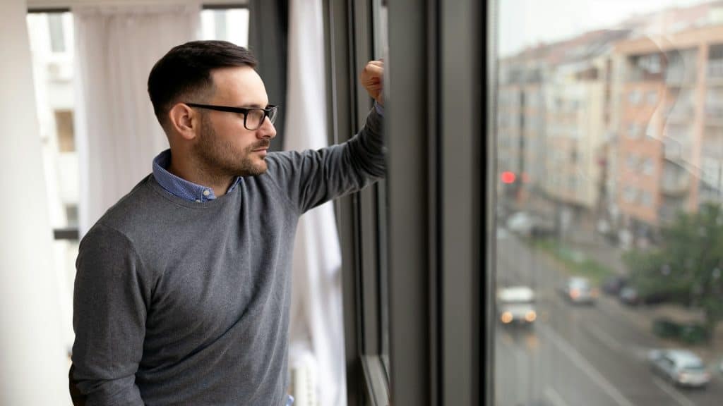 man thinking seriously indoors