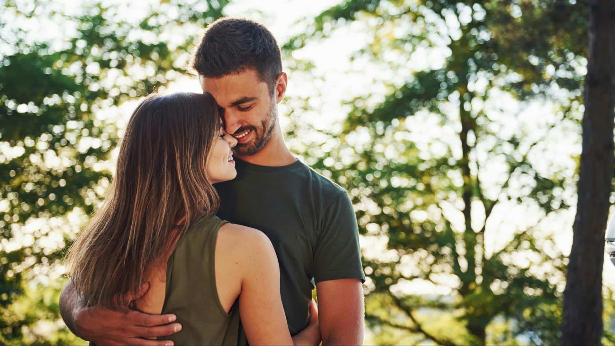 A man hugging woman