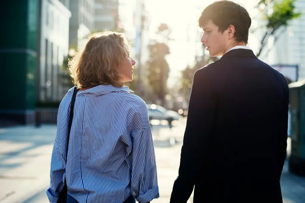 A man and woman looking at each other