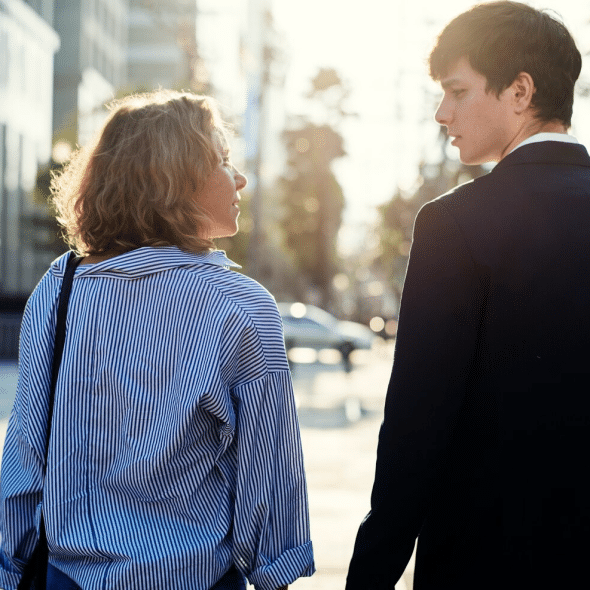 A man and woman looking at each other