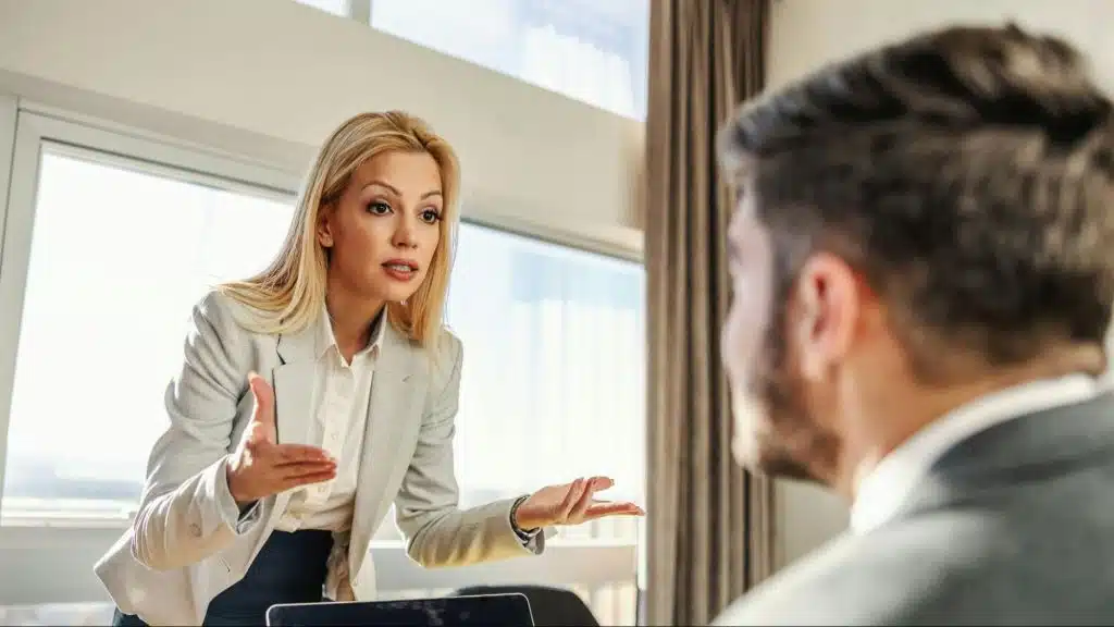 Woman talking to a man