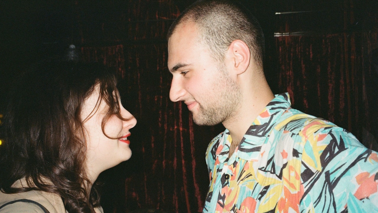 A man and a woman standing next to each other.