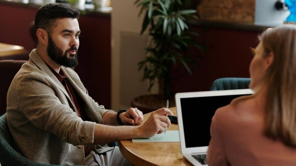 A man talking with a woman