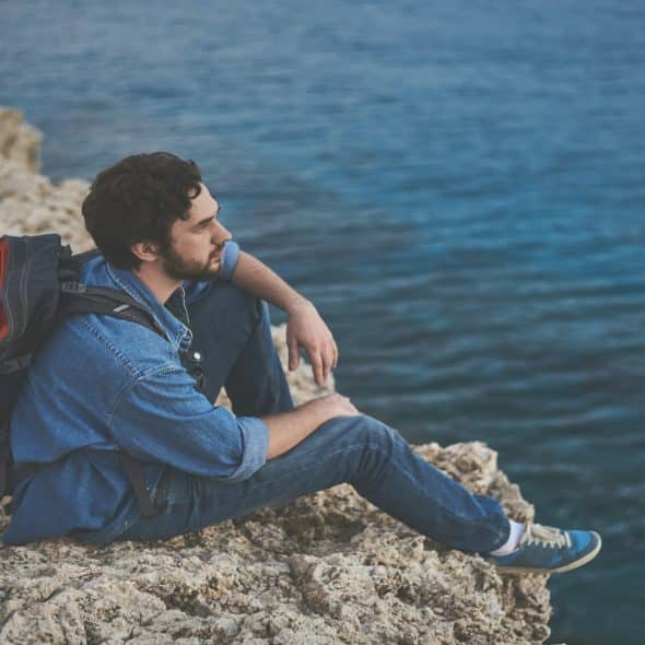 man sitting thoughtfully during quiet moment