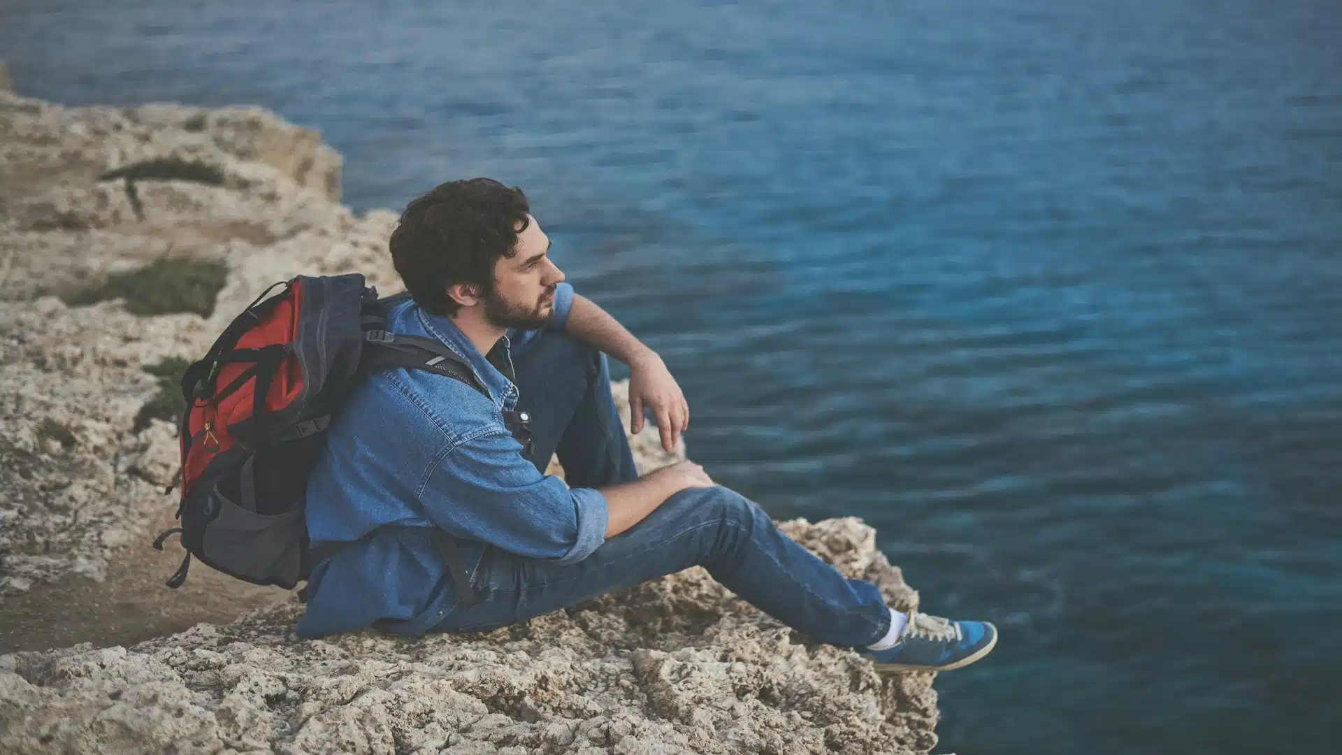 man sitting thoughtfully during quiet moment