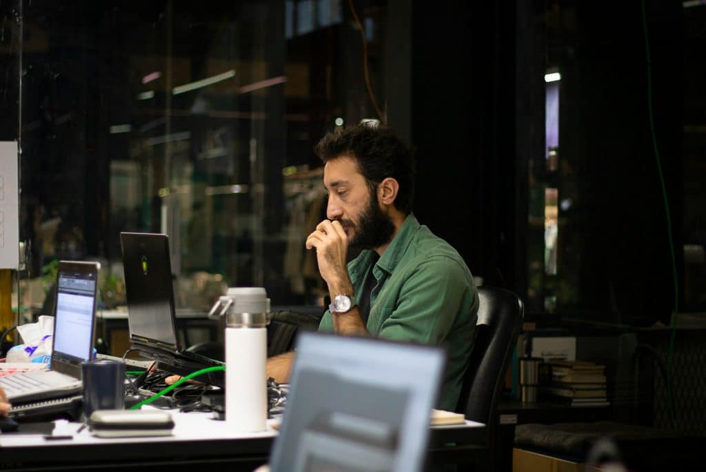 man working late office