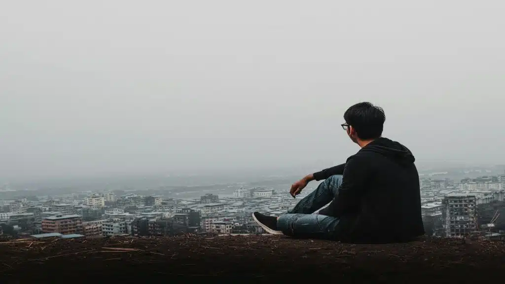 man sitting alone thoughtfully