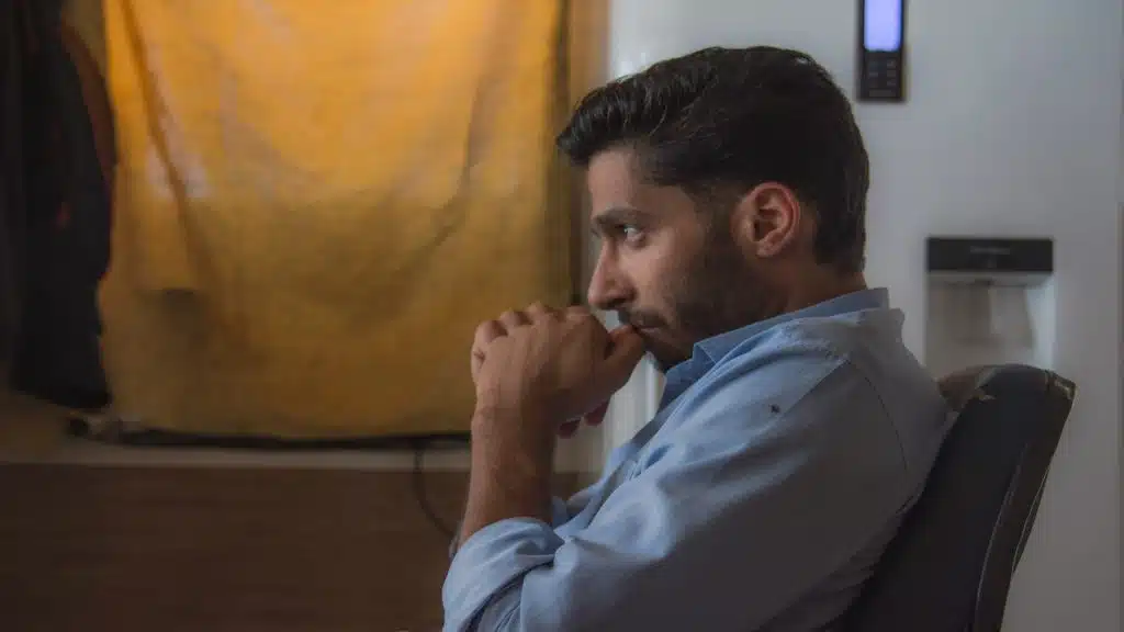 man thinking deeply alone