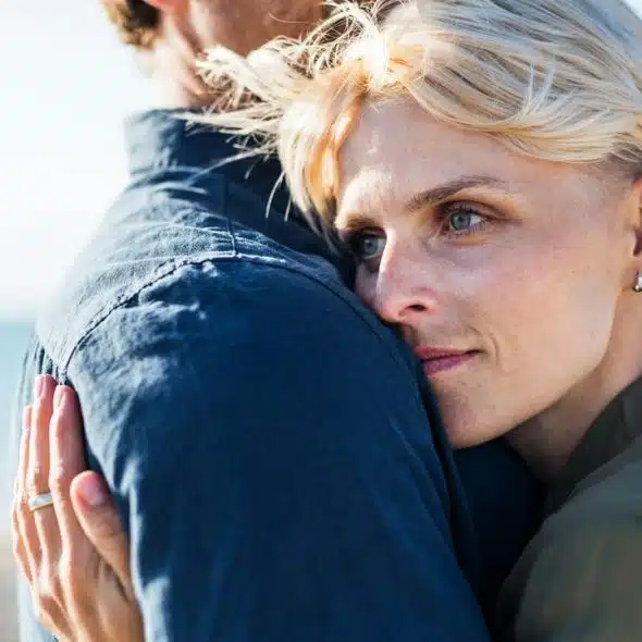 A woman hugging a partner