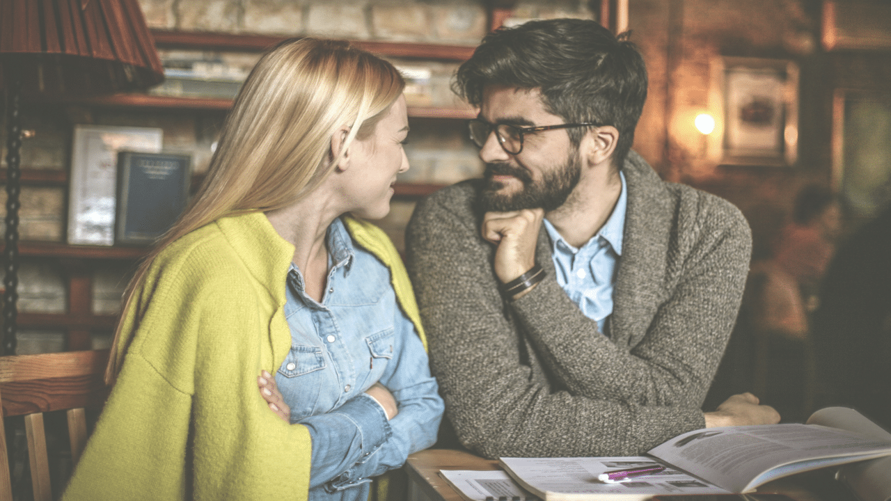 A couple looking at each other while smiling