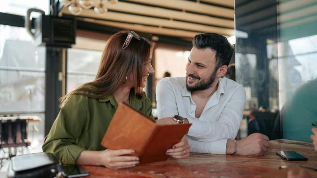 A man and woman smiling to each other
