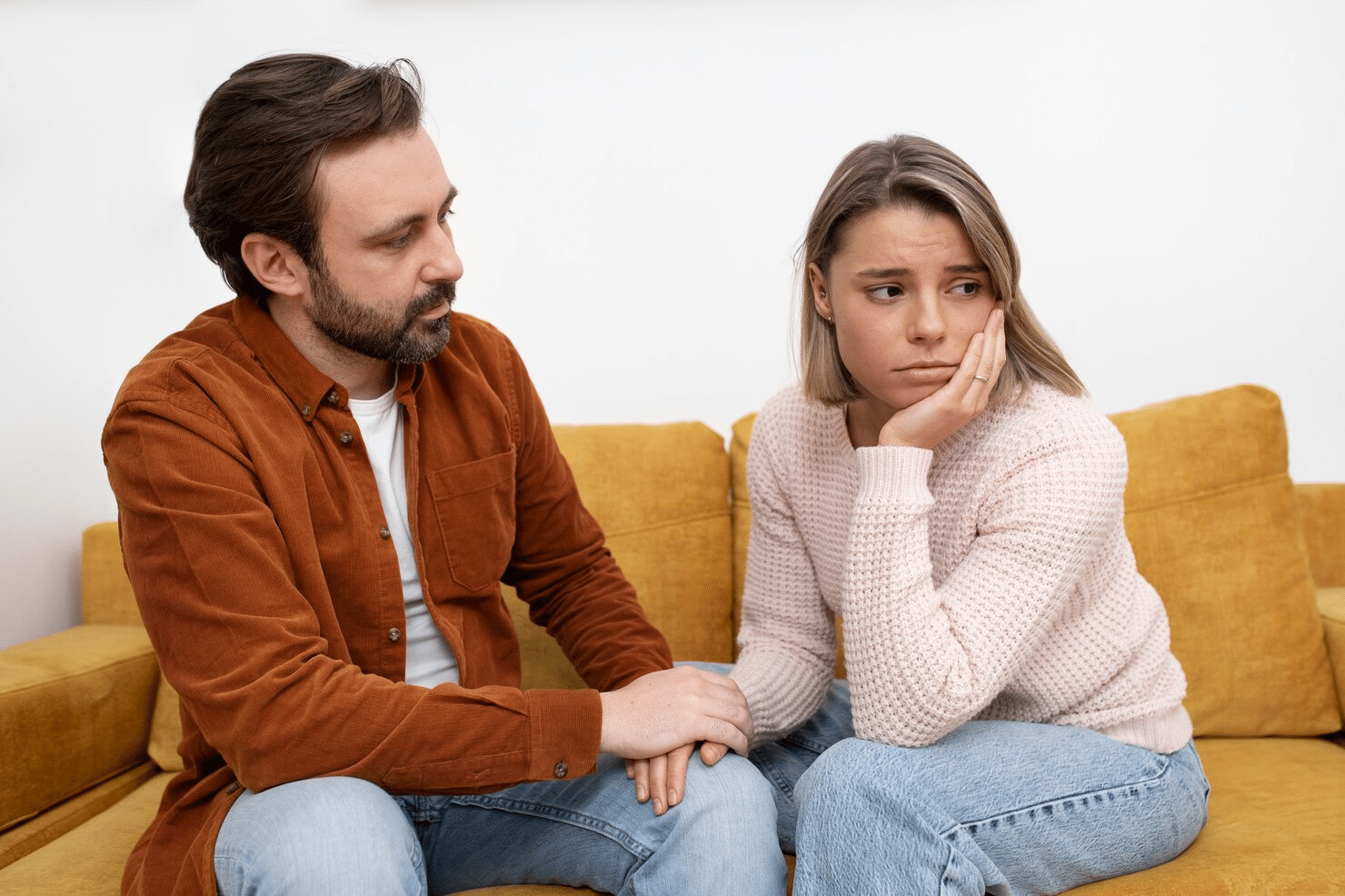 A man trying to speak with a woman