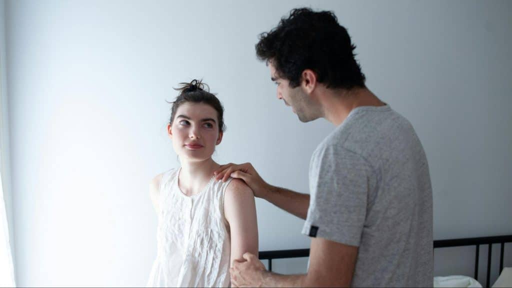 Woman smiling to a man for assurance