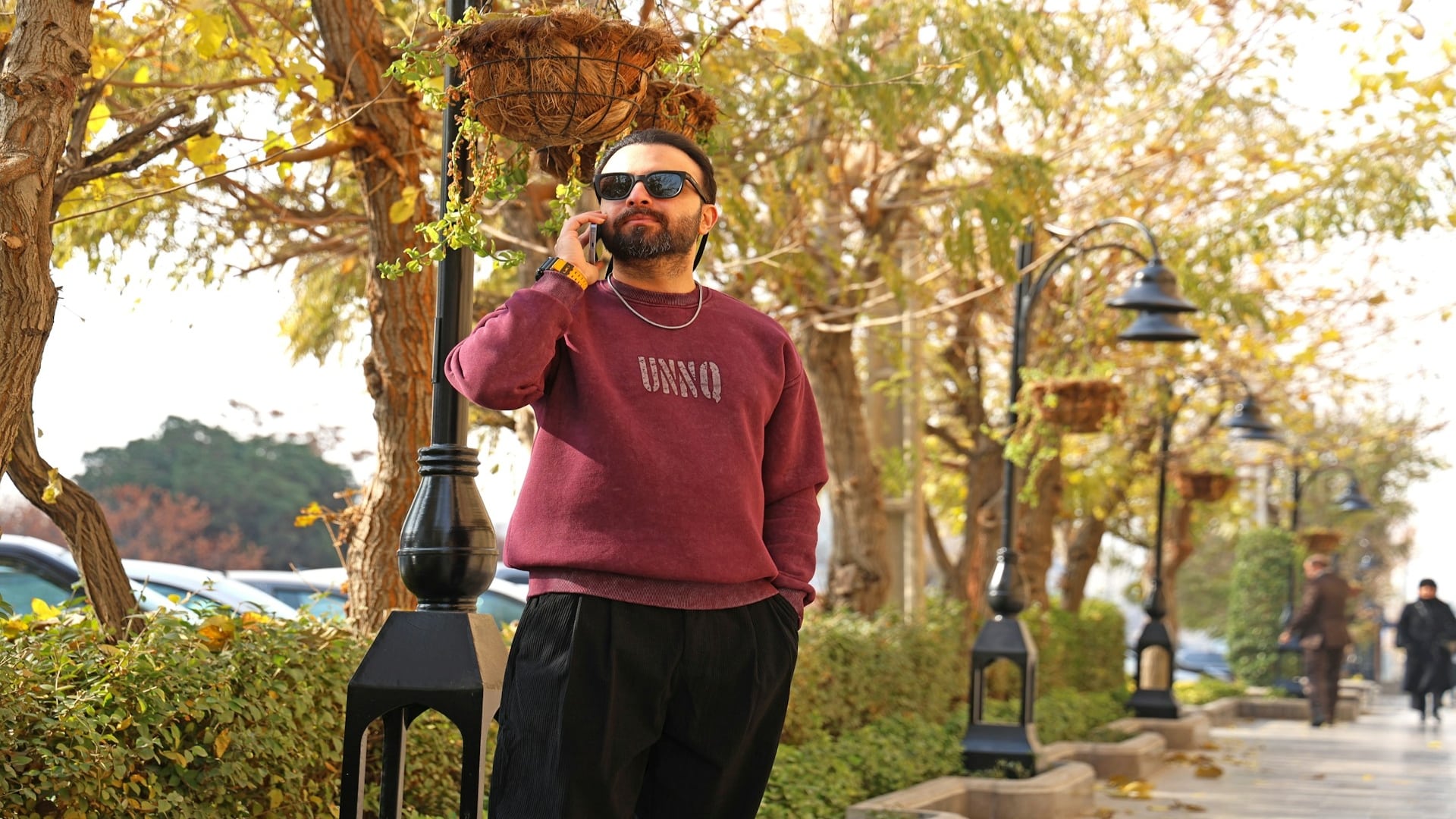man standing confidently outdoors