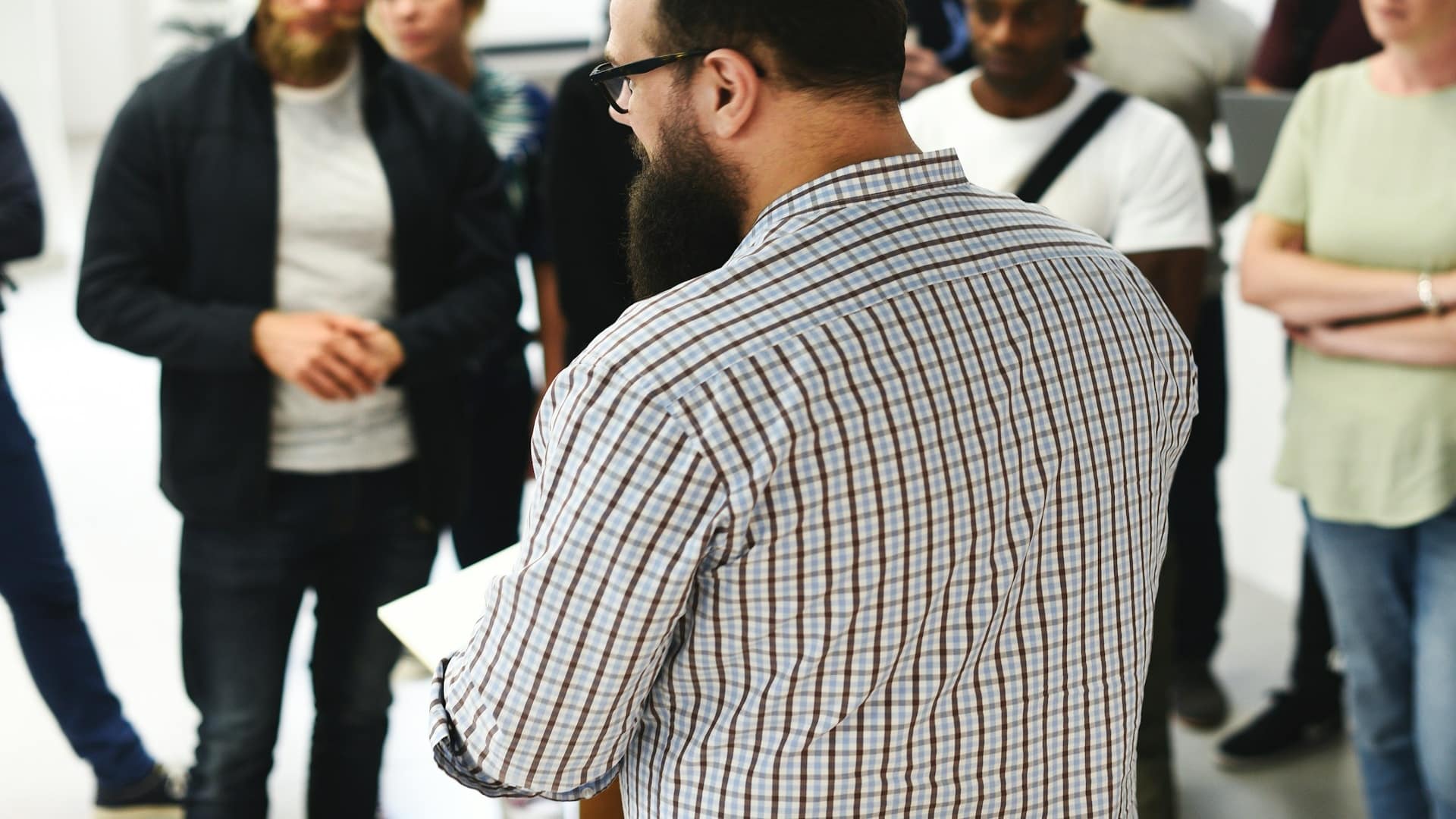 person standing confidently during discussion
