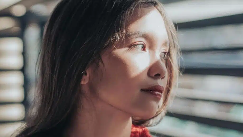 A woman gazing out a window