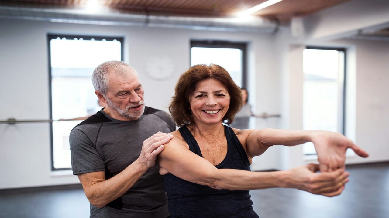 A senior couple exercising together