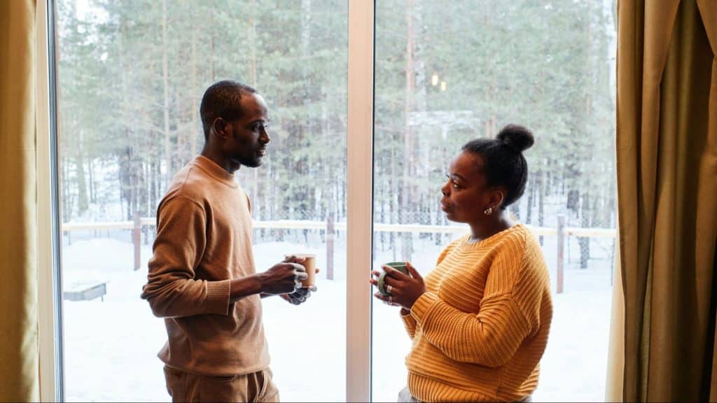 A man and woman facing each other
