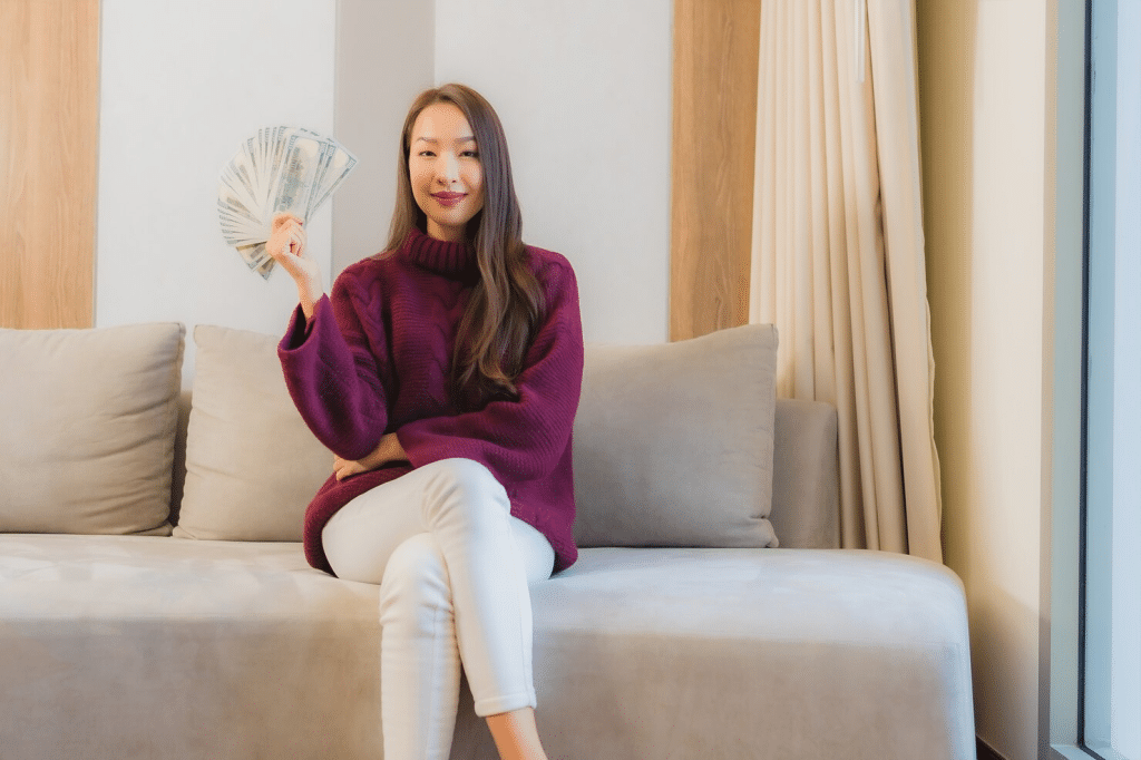 Woman holding a lot of money