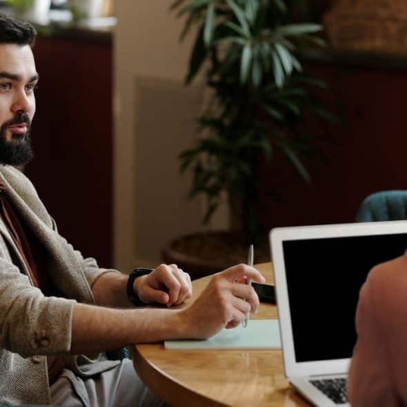 A man talking with a woman