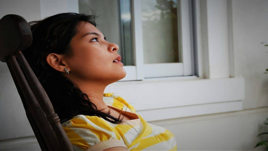 woman sitting quietly thinking