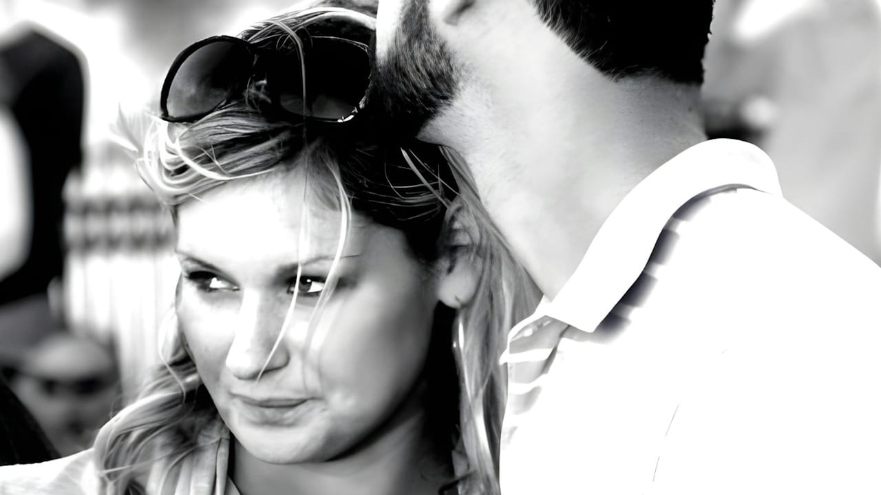 A man and a woman standing next to each other.