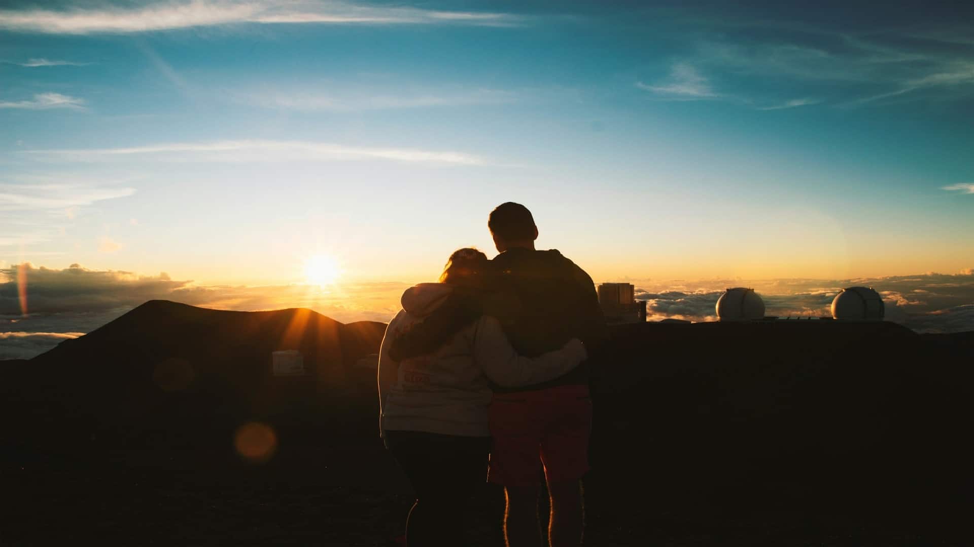 couple watching sunset together