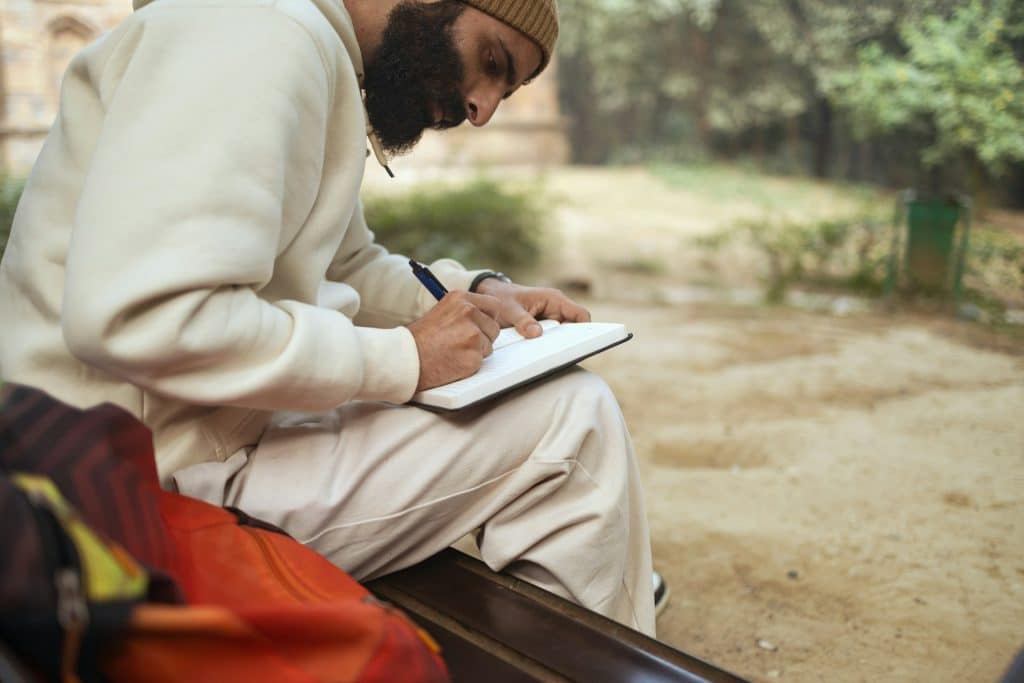 man journaling quietly
