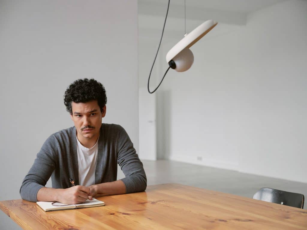 reflective man journaling
