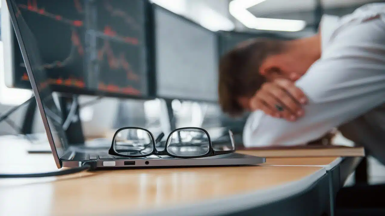 A man looking stressed at work