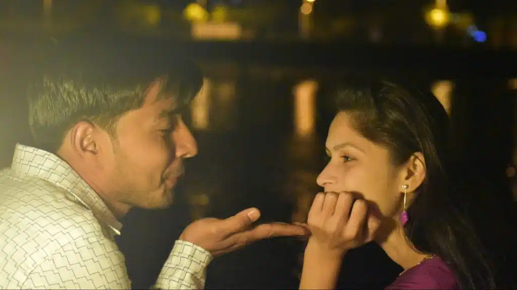 A man and woman facing each other