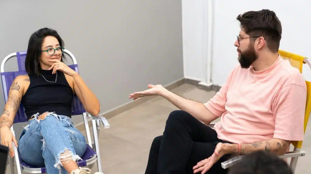 A couple conversing while sitting together.